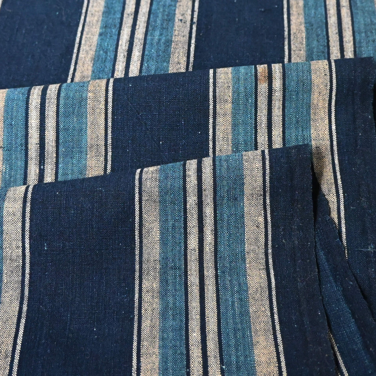 Close view of vintage Japanese indigo stripe cotton piece, originally a part of a futon cover, mid-20th century.