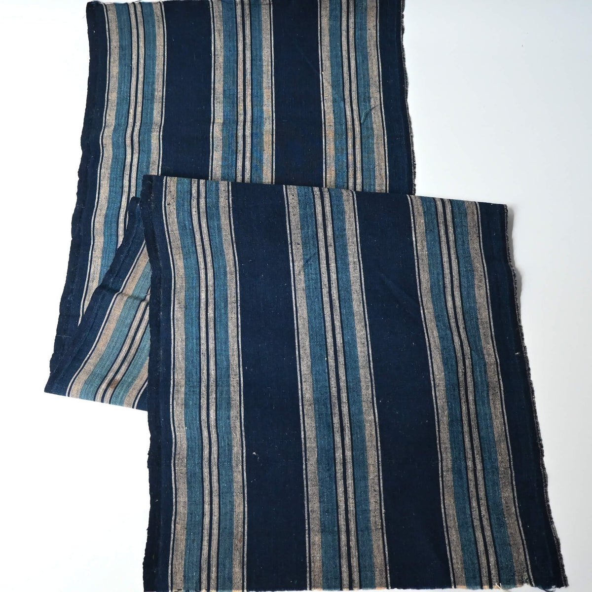 Full view of vintage Japanese indigo stripe cotton piece, originally a part of a futon cover, mid-20th century.