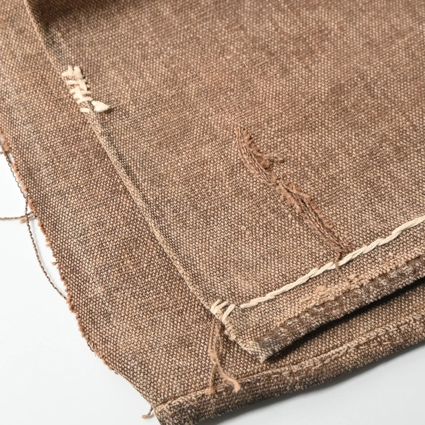 Detailed view of vintage heavy cotton sake bag Sakabukuro with some hand-mended repairs.