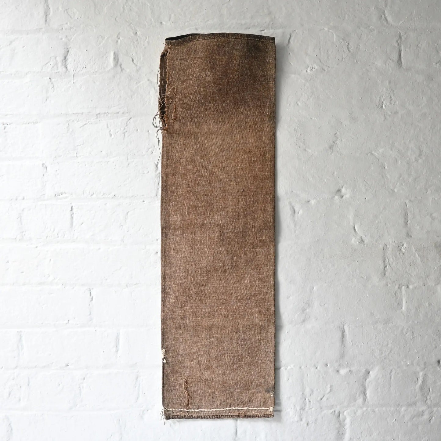 Full view of vintage heavy cotton sake bag called Sakabukuro, dyed with kakishibu fermented persimmon juice.