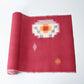 Vintage Japanese kasuri cotton kimono fabric roll in raspberry pink with a bold pattern from the mid 20th century.