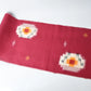 Vintage Japanese kasuri cotton kimono fabric roll in raspberry pink with a bold pattern from the mid 20th century.