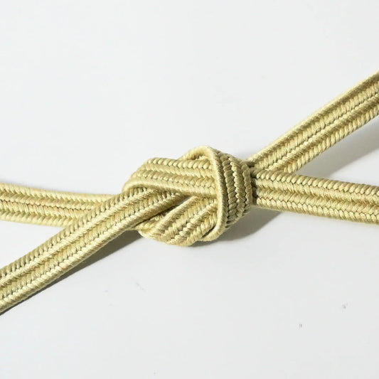 Vintage Japanese kimono dress accessories silk Obijime in light green tied in a knot.