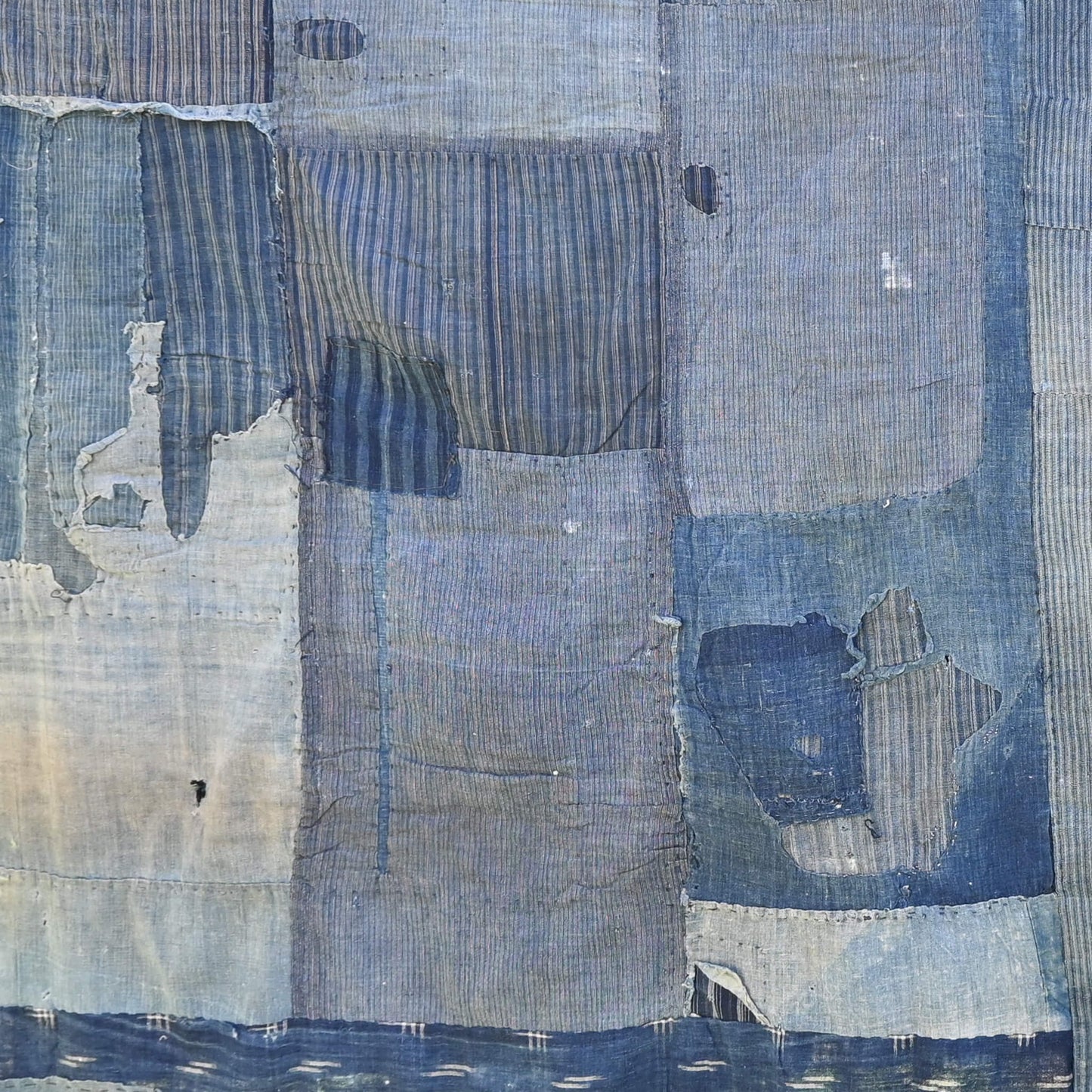 Part of vintage old Japanese Boro indigo cotton futon cover, showcasing beautifully worn out parts.