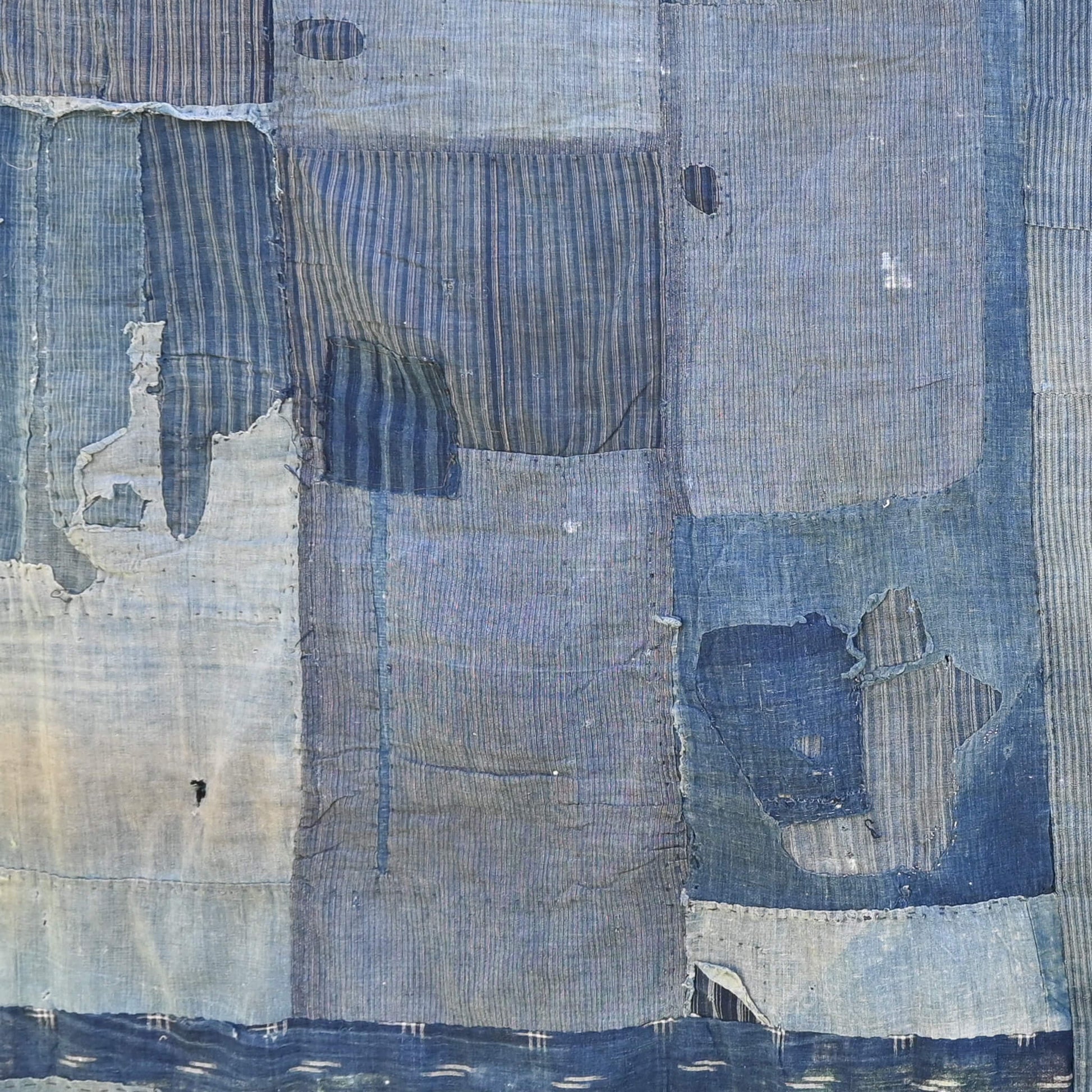 Part of vintage old Japanese Boro indigo cotton futon cover, showcasing beautifully worn out parts.