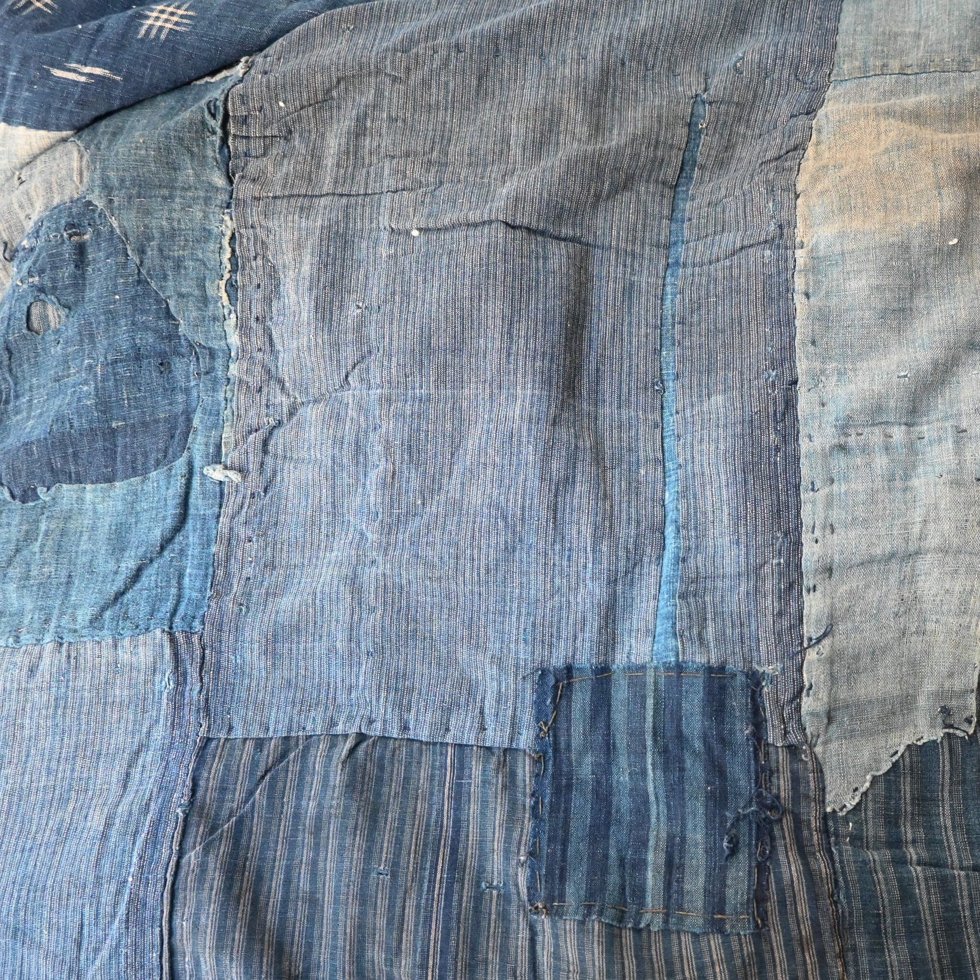 Vintage indigo Boro futon cover, carefully mended by hand stitching.