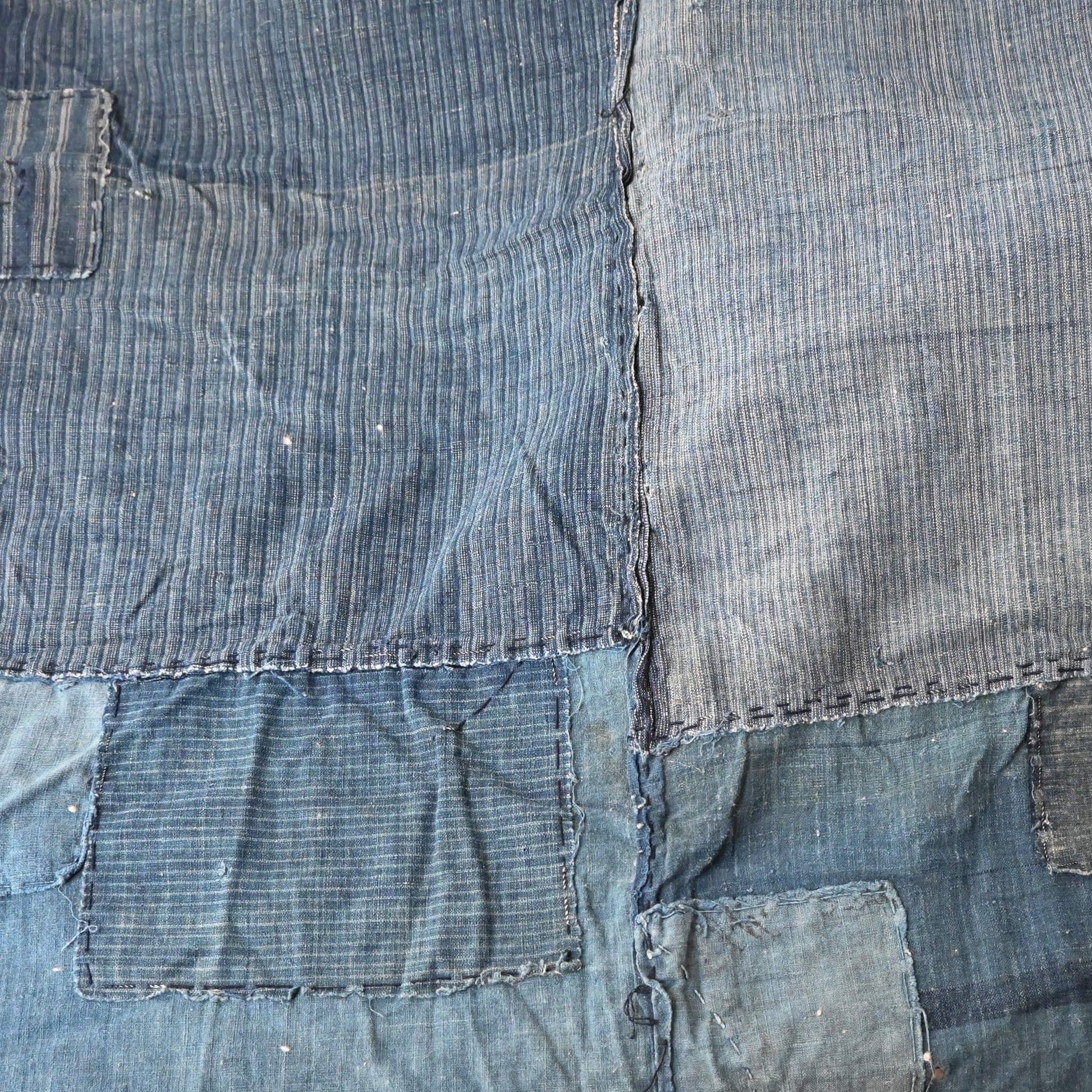 Beautifully faded indigo stripe cotton, showcasing its age.