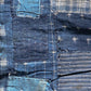 Vintage Japanese indigo Kasuri cottons with mending stitches.