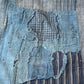 Vintage indigo futon cover, showcasing beautifully worn out part.