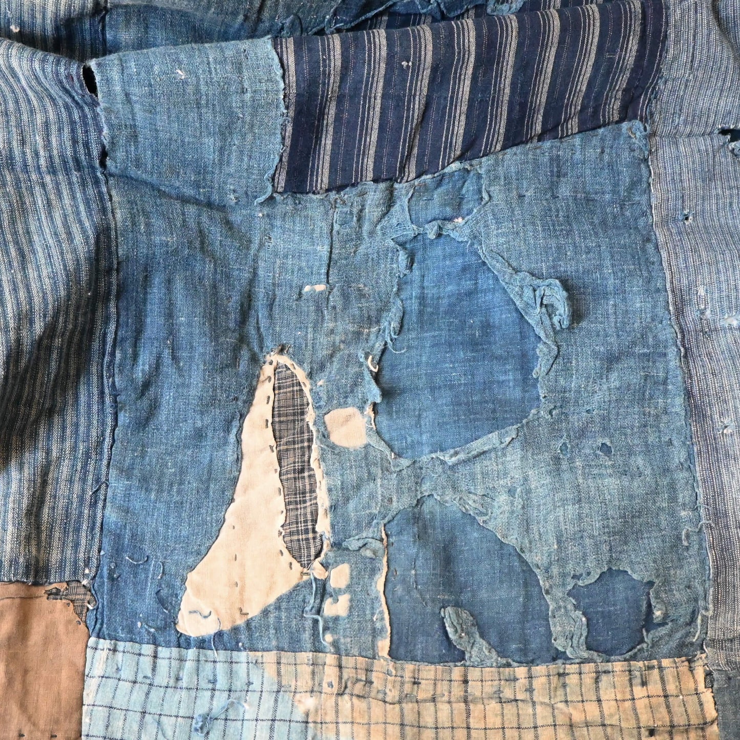 Indigo Boro futon cover, showcasing worn out rag part.