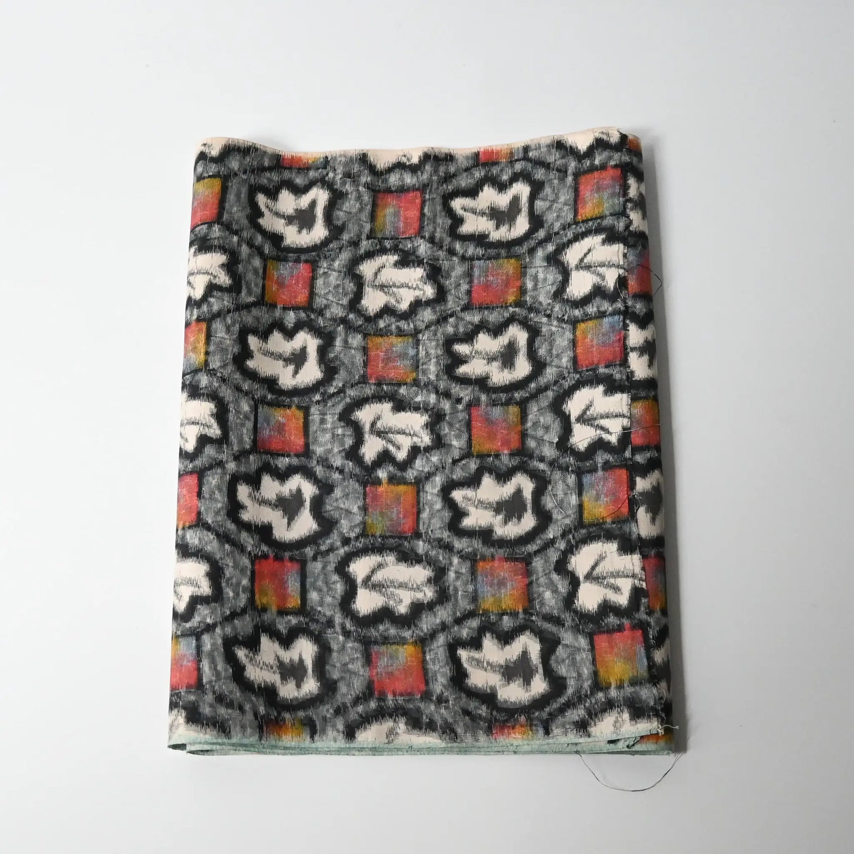 Vintage Japanese Meisen silk kimono fabric piece with a leaf motif in grey and pink from the mid-20th century.