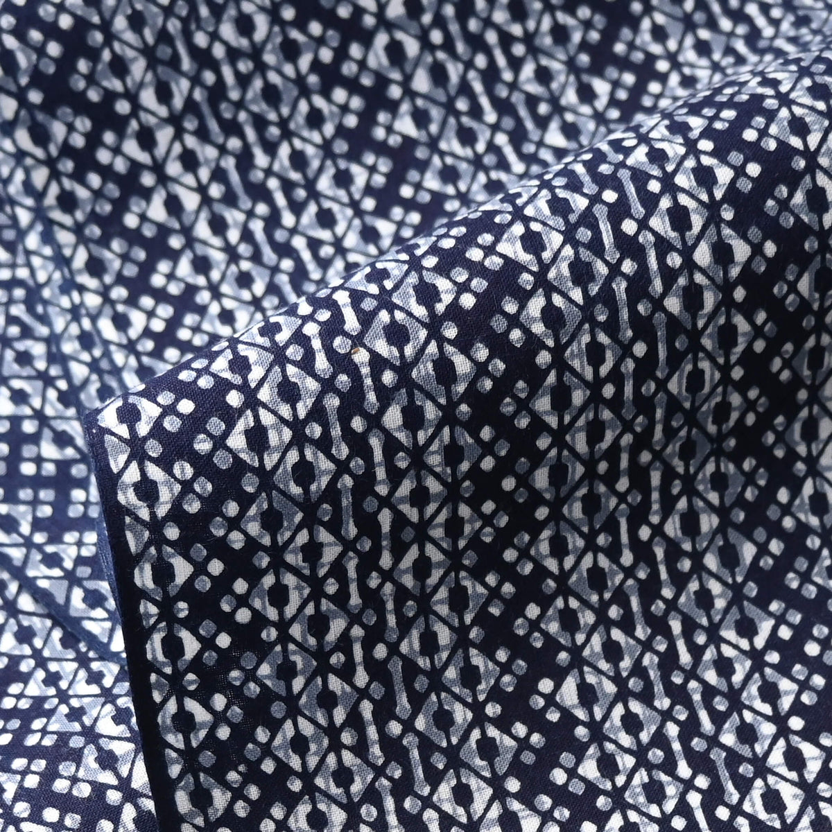 Close-up view of vintage traditional Japanese men's cotton yukata fabric with geometric pattern.