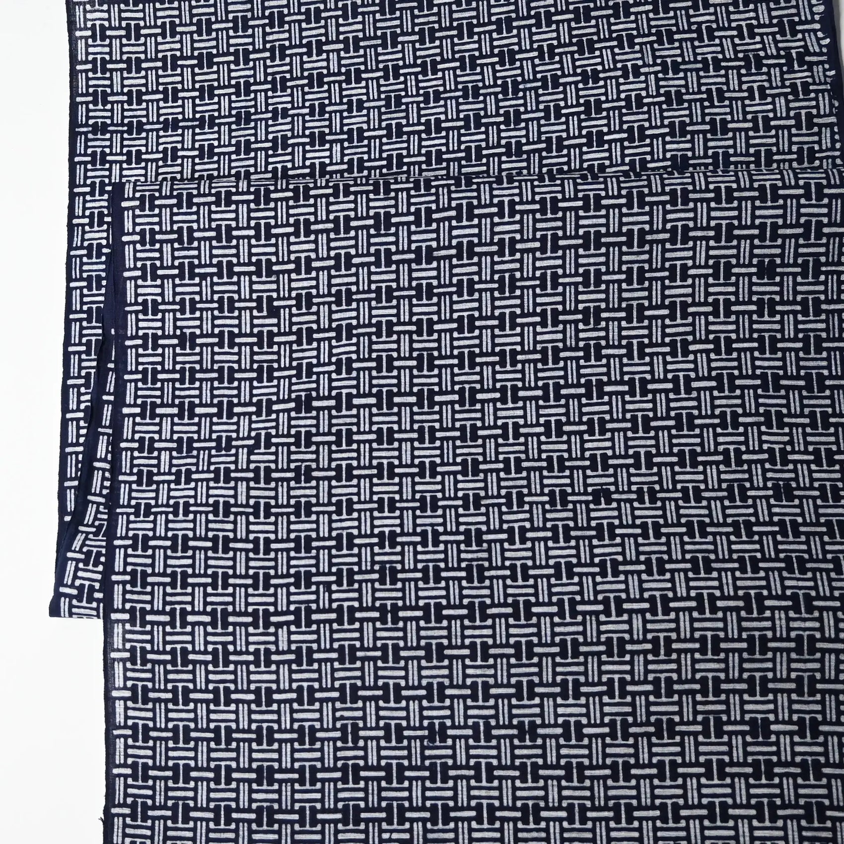 Vintage Japanese men's yukata cotton fabric with geometric pattern, sold by the metre.