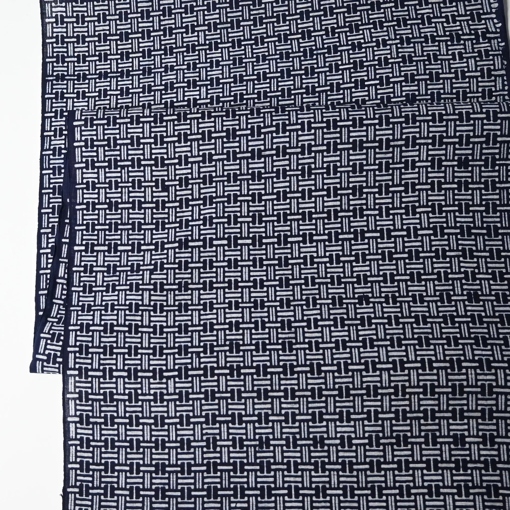 Vintage Japanese men's yukata cotton fabric with geometric pattern, sold by the metre.
