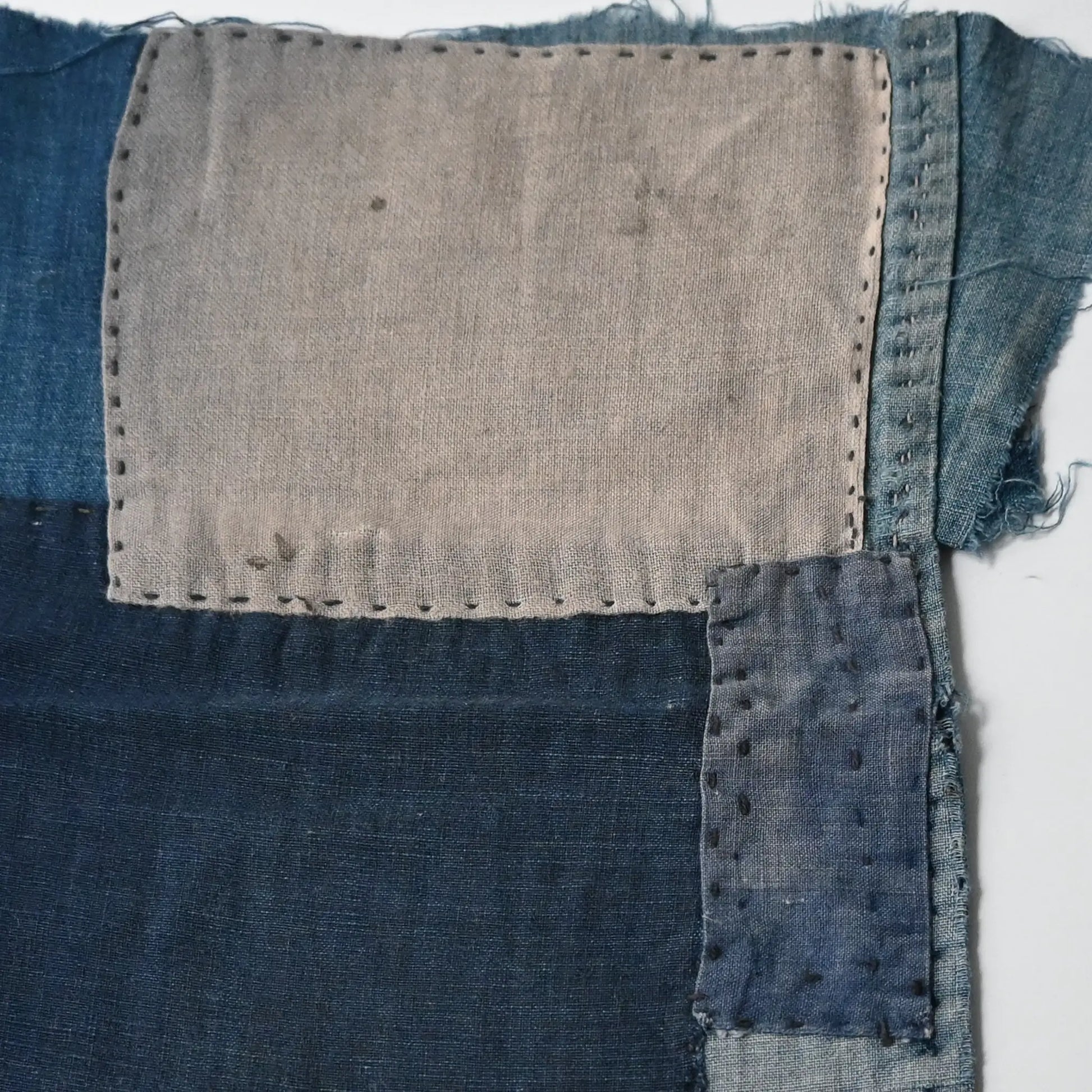 Close-up view of the piece from deconstructed vintage indigo cotton Japanese Momohiki pants.