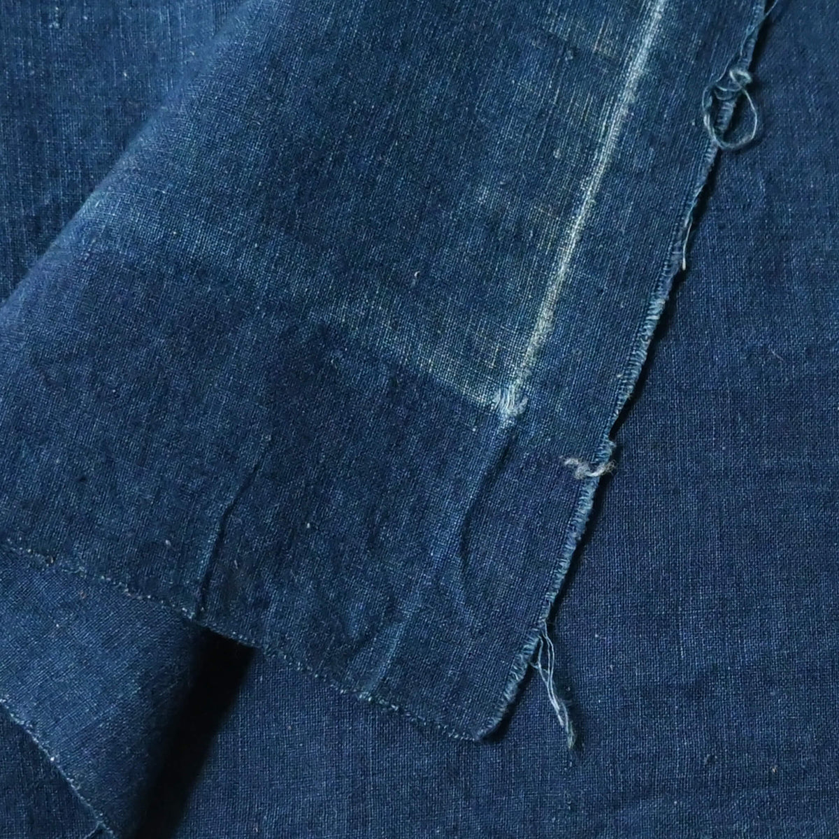 Close-up view of vintage Japanese plain indigo cotton from undone kimono.