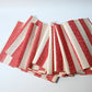 Full view of vintage Japanese Shifu paper yarn red and white stripe obi from the mid-20th century.