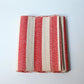 Vintage Japanese Shifu paper yarn red and white stripe obi from the mid-20th century.