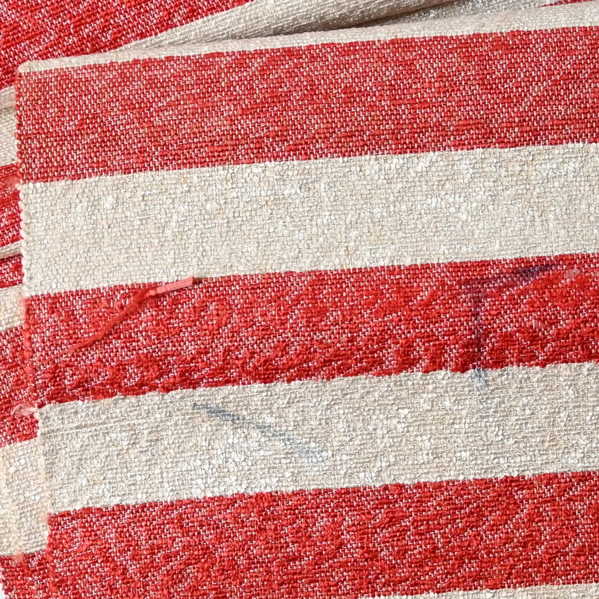 Stained part of vintage Japanese Shifu paper yarn red and white stripe obi from the mid-20th century.