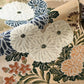 Detailed view of vintage Japanese women's silk brocade Maru obi with chrysanthemum motif.