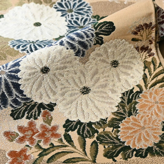Detailed view of vintage Japanese women's silk brocade Maru obi with chrysanthemum motif.