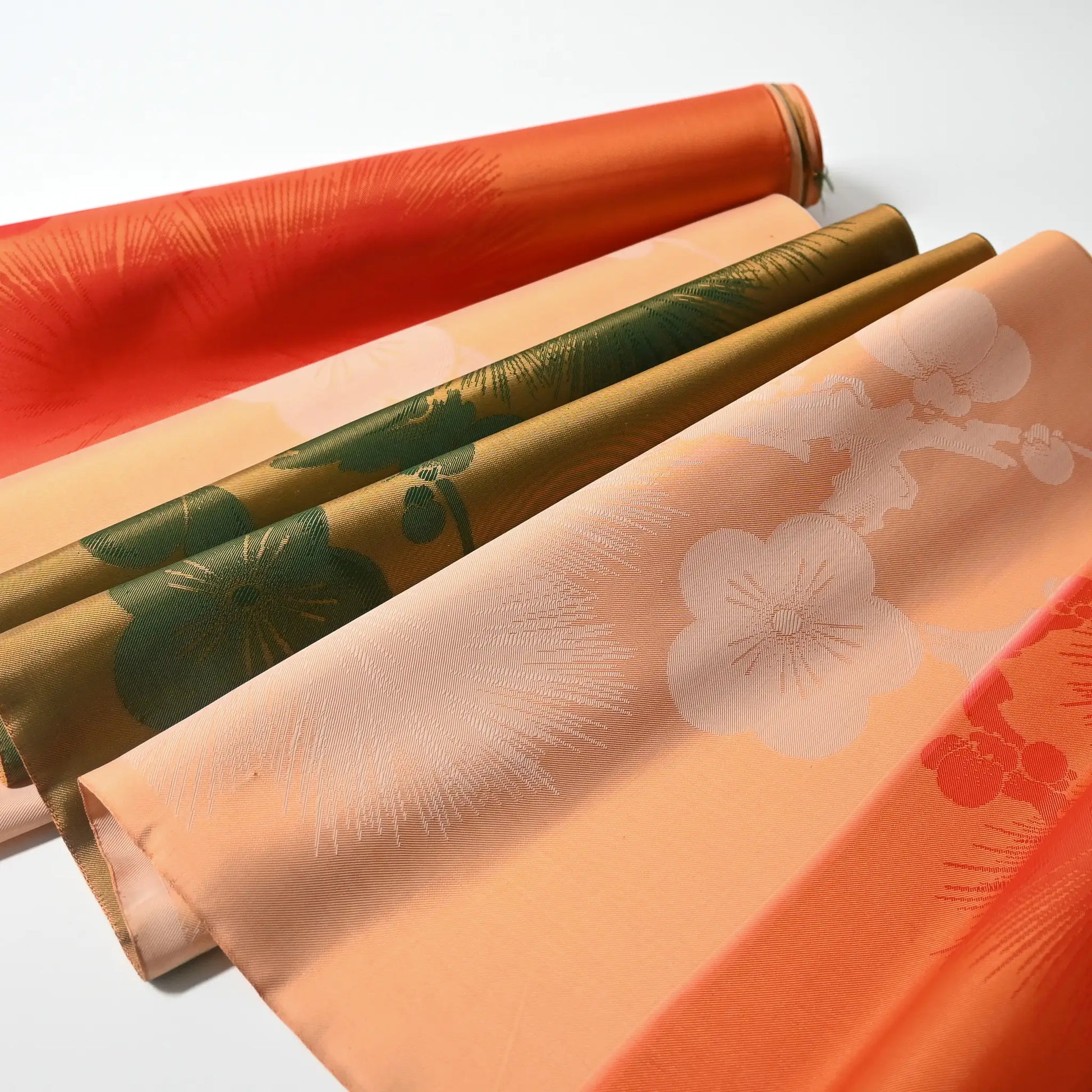 Vintage Japanese silk fabric roll with plum blossom and pine tree, drapes beautifully.