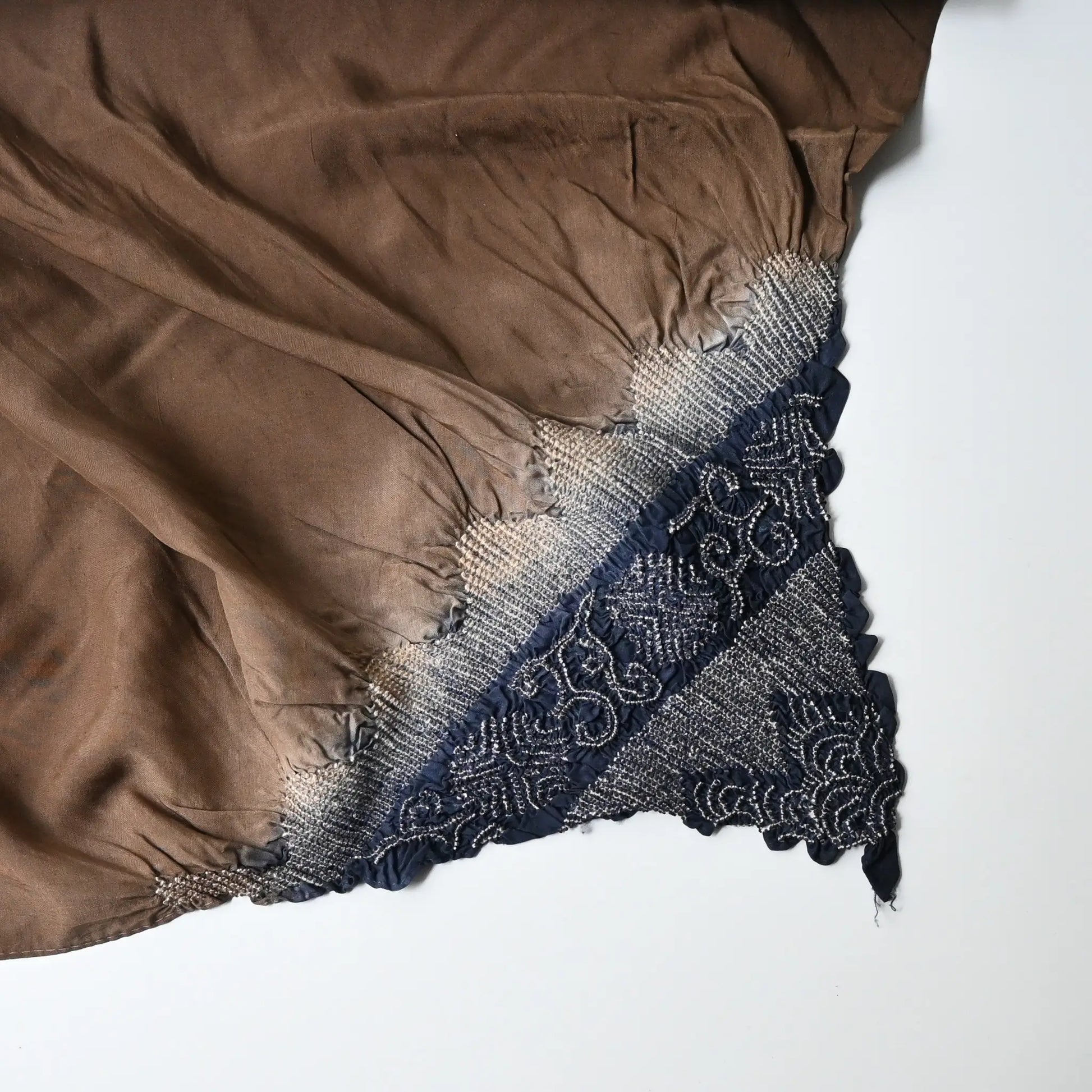 Detailed view of vintage Japanese silk furoshiki with a hand-dyed shibori in brown.