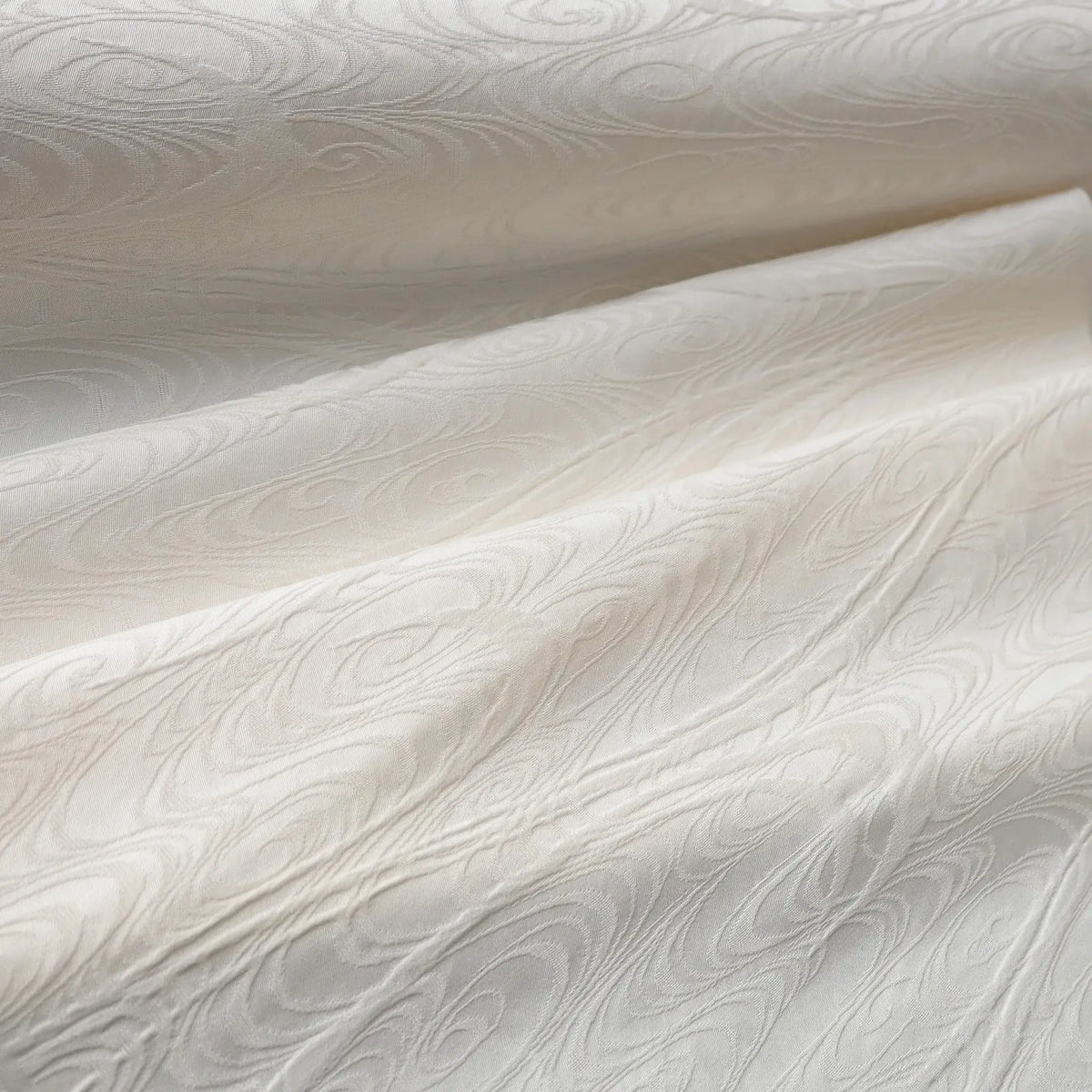 Detailed view of vintage Japanese silk jacquard kimono fabric with running water motif.