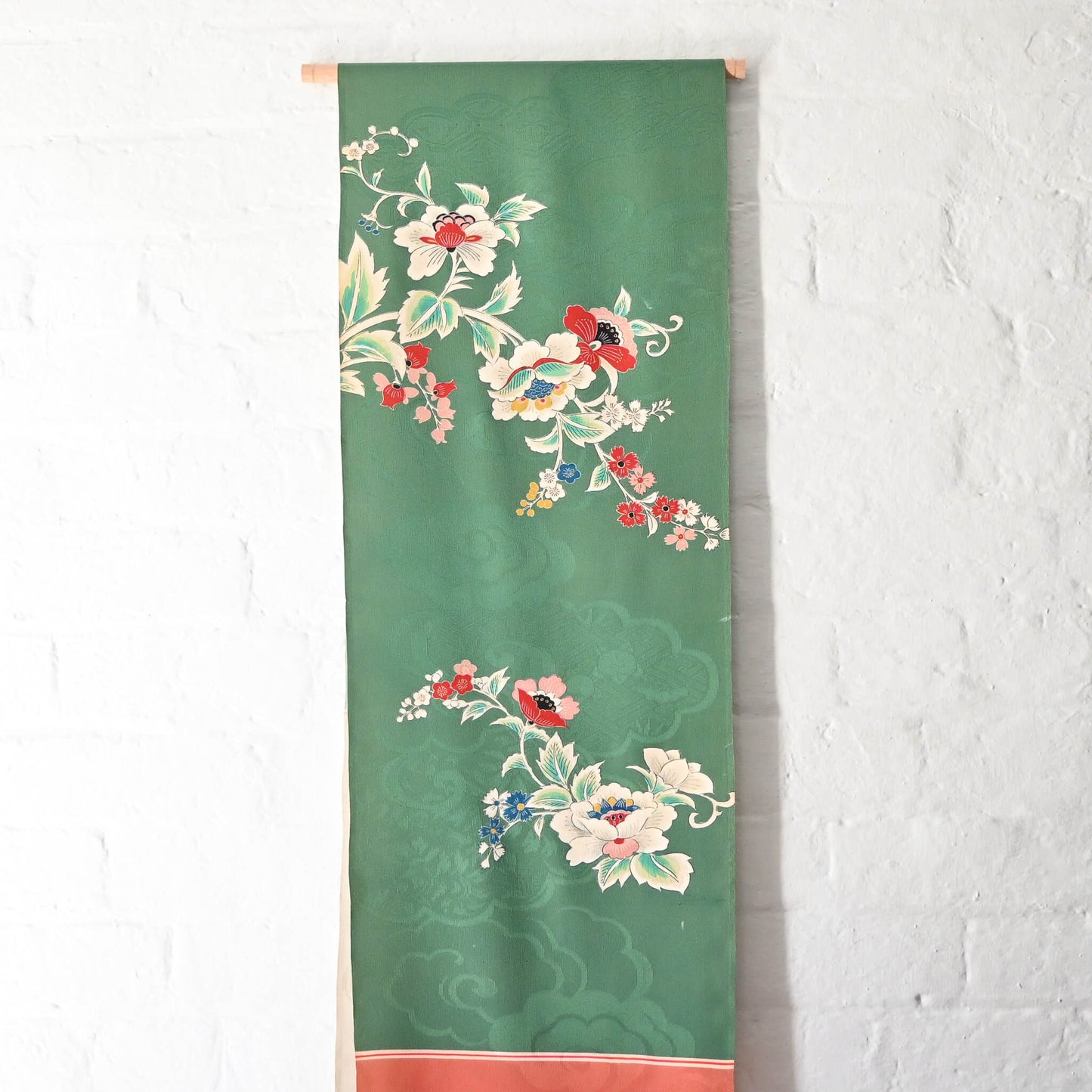 Green Rinzu silk jacquard panel with traditional Japanese seasonal flowers.
