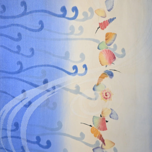 Delicate hand painted wave and shell motif.