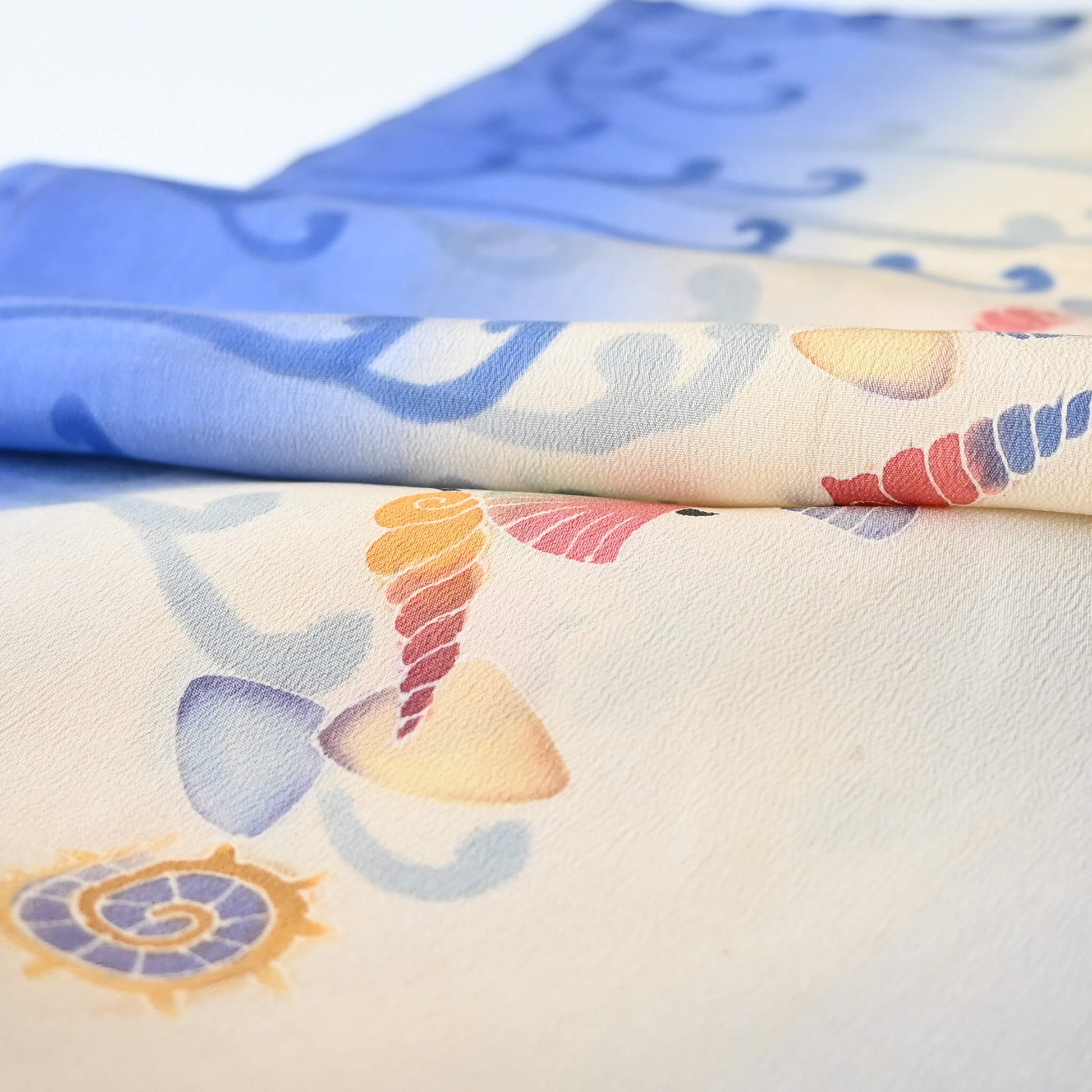 Detailed view of vintage Japanese women's summer silk kimono fabric piece, soft texture.