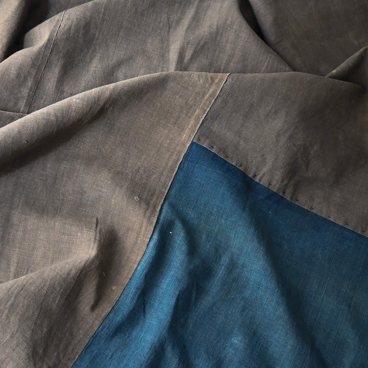 Detail of naturally dyed brown cotton and indigo section on vintage Japanese futon cover
