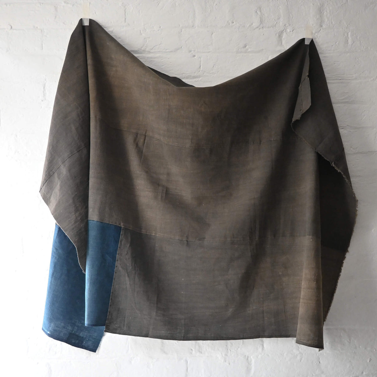 Full view of vintage three-panel naturally dyed brown and indigo cotton futon cover