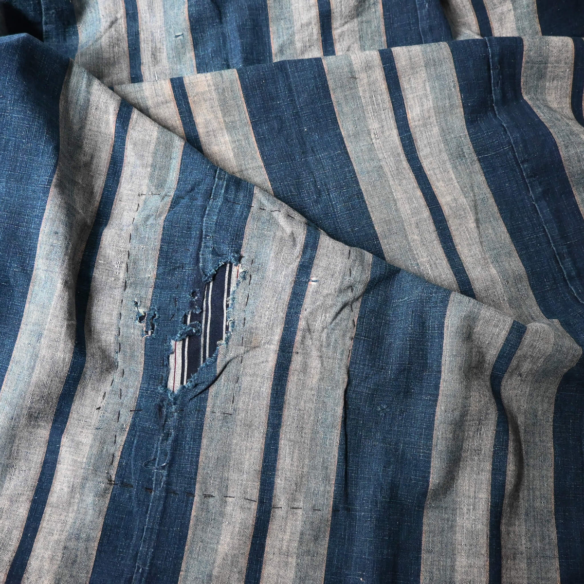 Vintage Japanese indigo stripe futon cover with old mends and patches, suitable for boro and patchwork projects