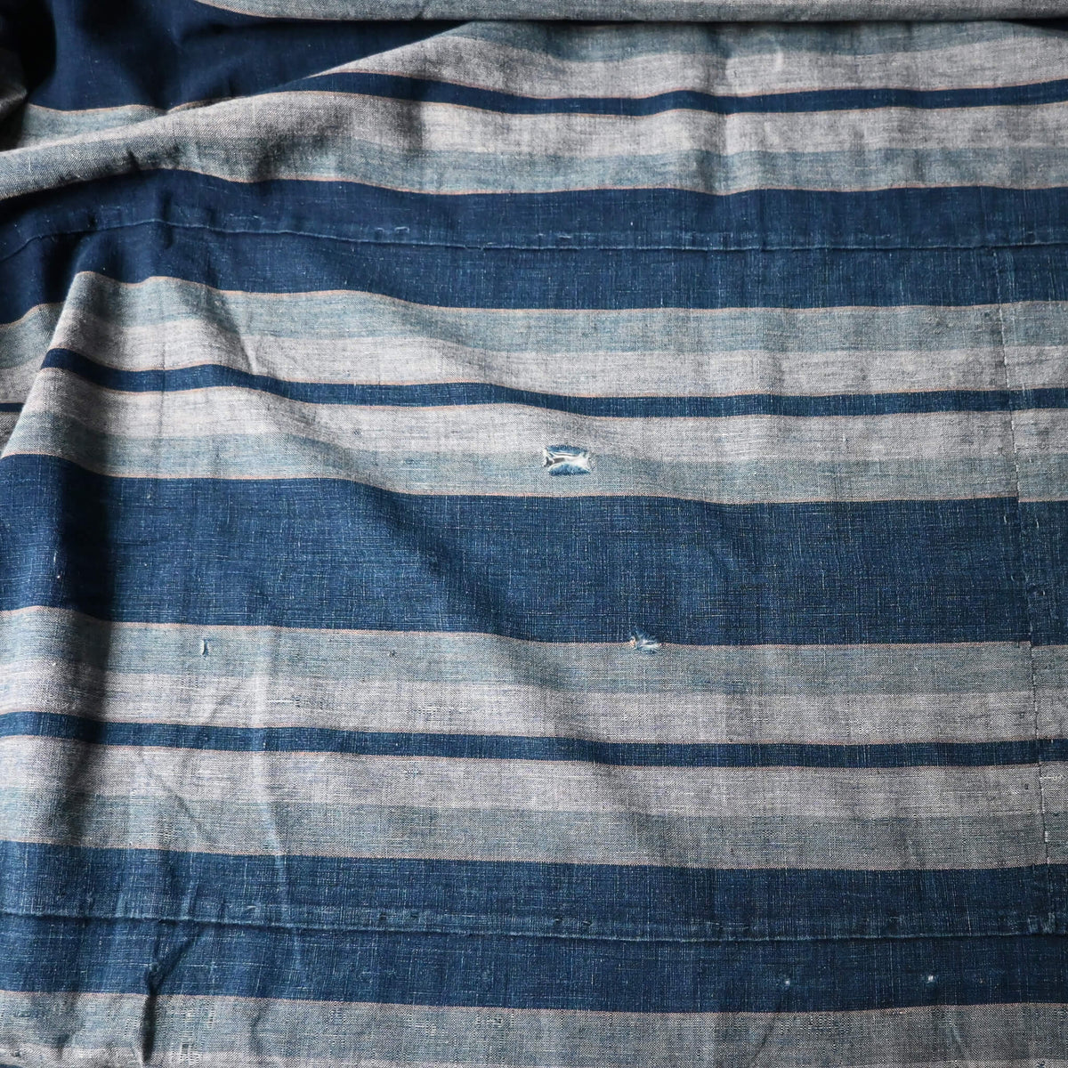 Vintage Japanese indigo stripe futon cover with old mends and patches, suitable for boro and patchwork projects