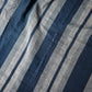 Close-up view of vintage Japanese indigo stripe futon cover with old mends and patches, suitable for boro and patchwork projects