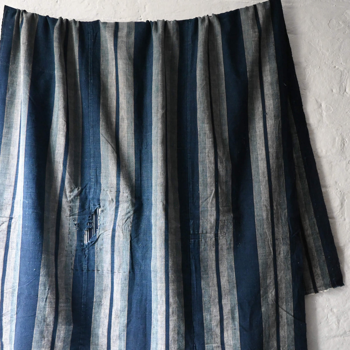 Vintage Japanese indigo stripe futon cover with old mends and patches, suitable for boro and patchwork projects