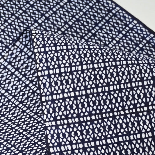 Close-up view of vintage Japanese geometric yukata cotton fabric sold by the metre.