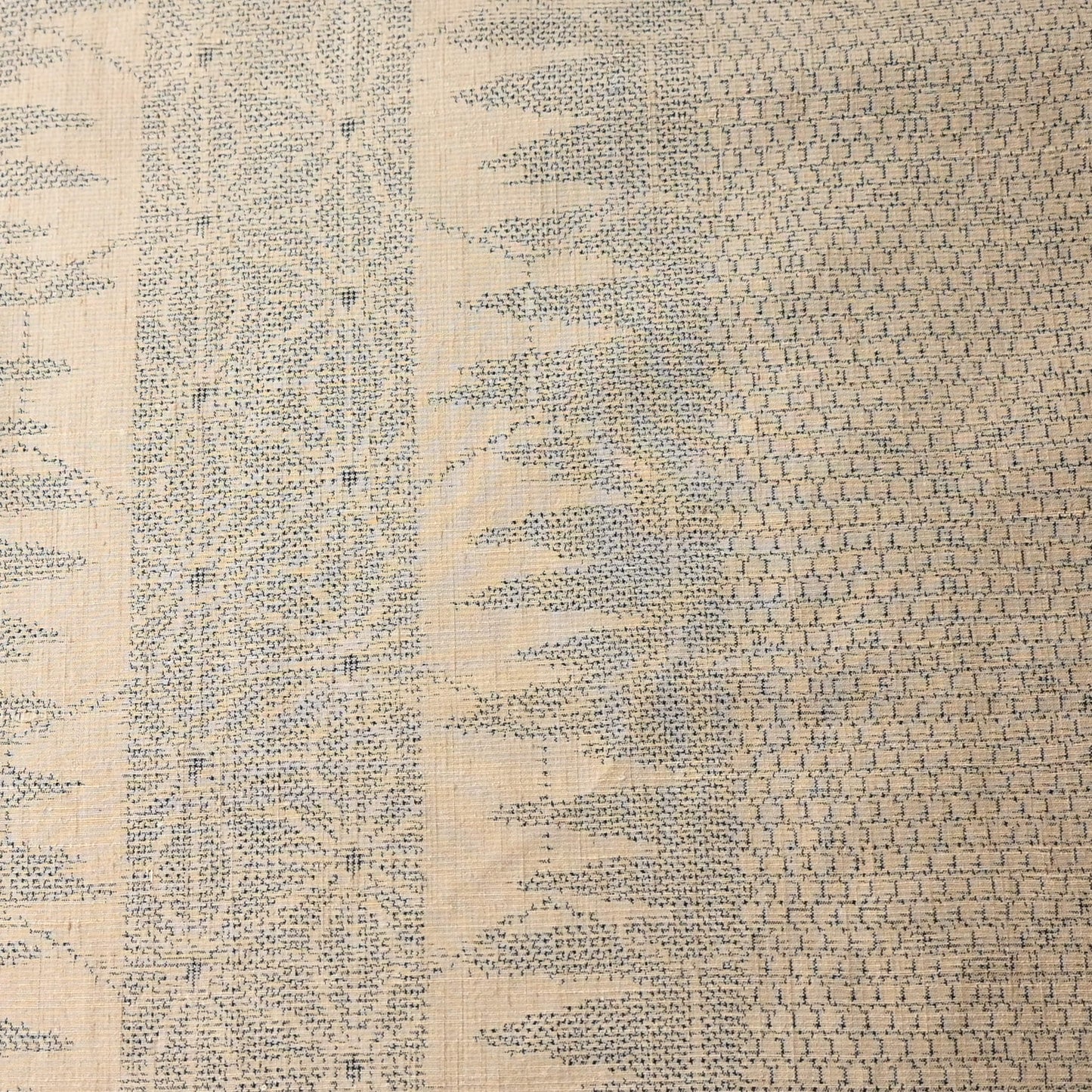 Cream beige tsumugi silk with geometric pattern in blue.