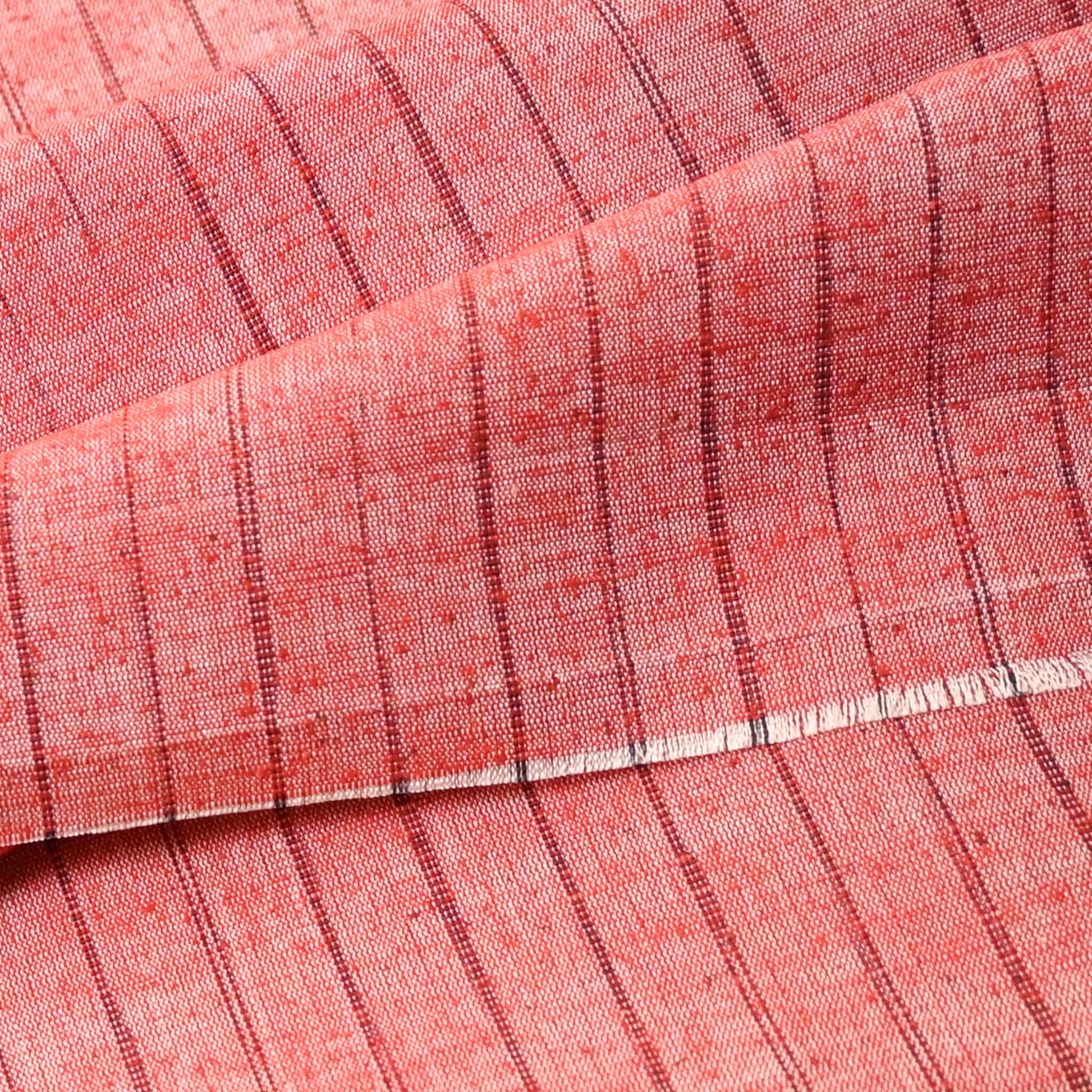 Detailed view of vintage tusmugi silk kimono fabric with textured slubs.
