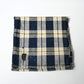 Vintage Japanese indigo and soft yellow check cotton futon cover panel with mended patches.