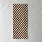 Full view of vintage Japanese white and brown diagonal stripe cotton.
