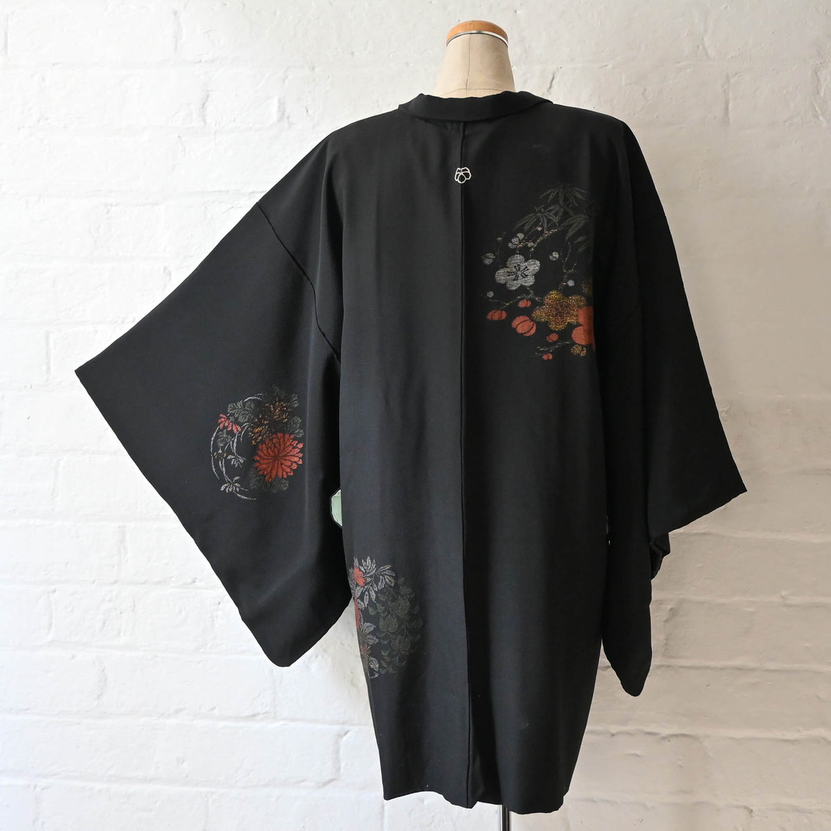 Woven plum blossom, chrysanthemum and peony motifs on vintage black silk haori.