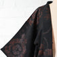 Vintage women's black silk crepe haori with woven peony pattern created with lacquer-coated threads.