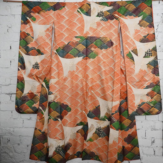 Vintage Japanese women's long-sleeved formal kimono Furisode with crane and wave, dynamic design.
