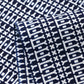 Close-up view of vintage Japanese geometric yukata cotton fabric sold by the metre.