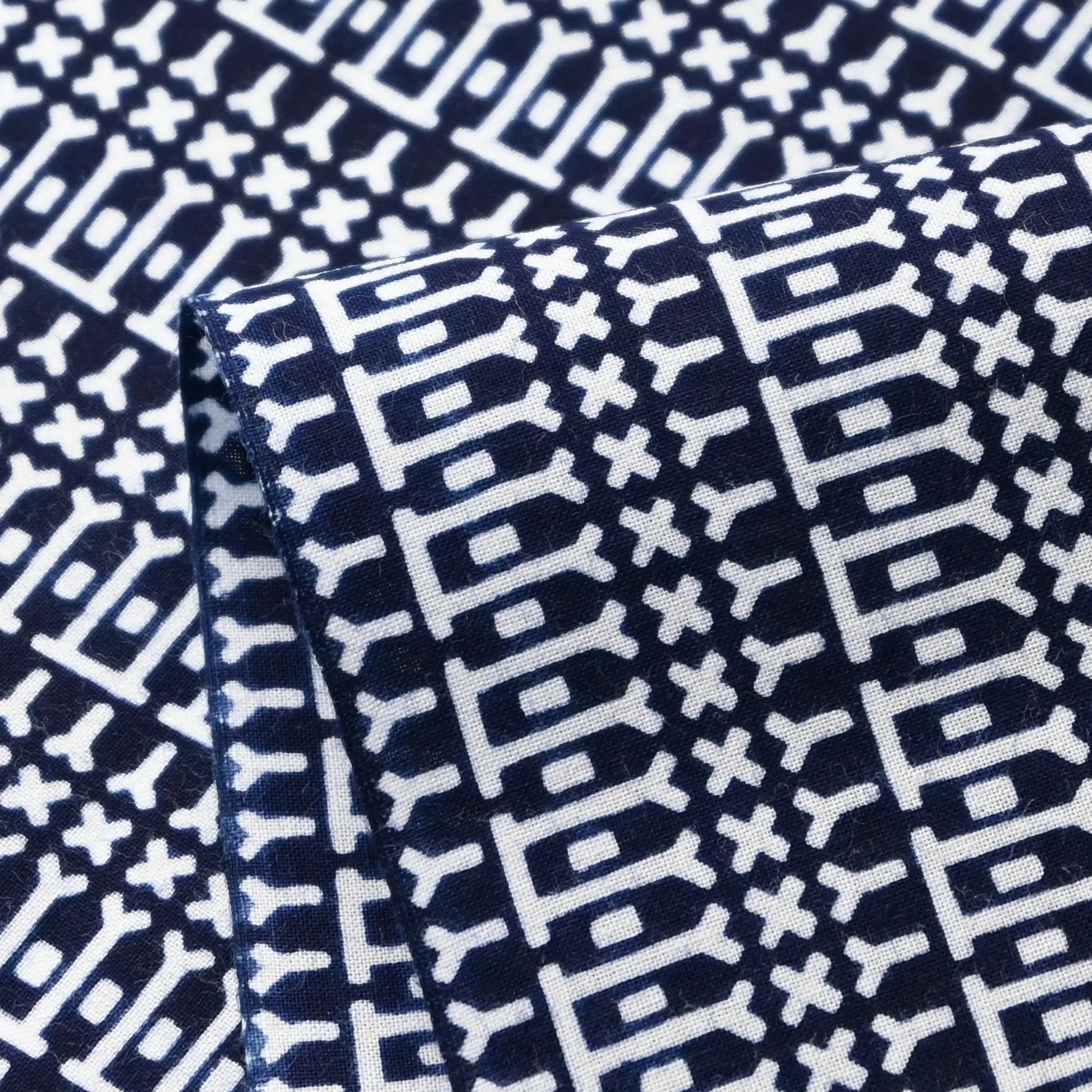 Close-up view of vintage Japanese geometric yukata cotton fabric sold by the metre.