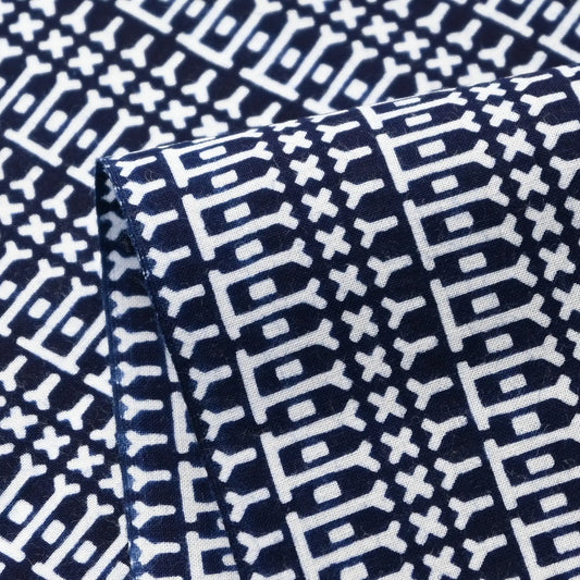 Close-up view of vintage Japanese geometric yukata cotton fabric sold by the metre.