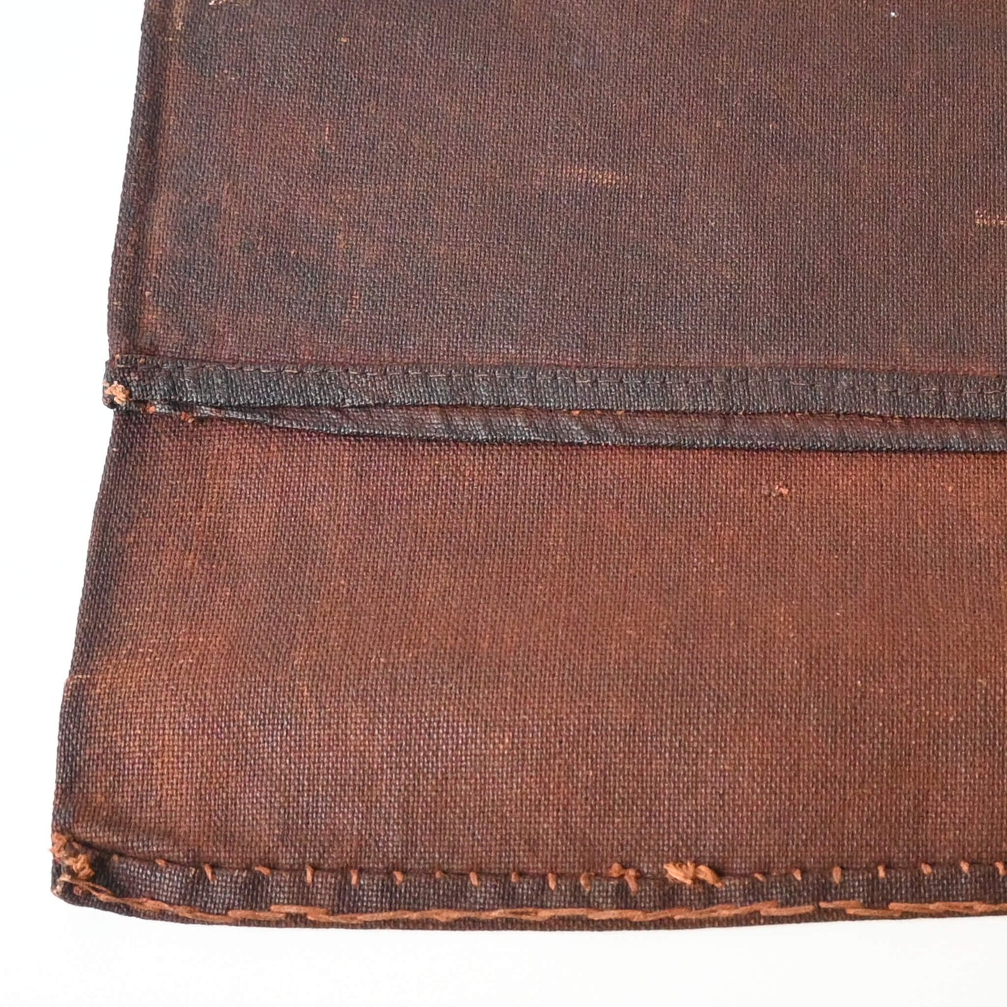Detailed view of vintage kakishibu, fermented persimmon juice, dyed cotton sake bag sakabukuro.