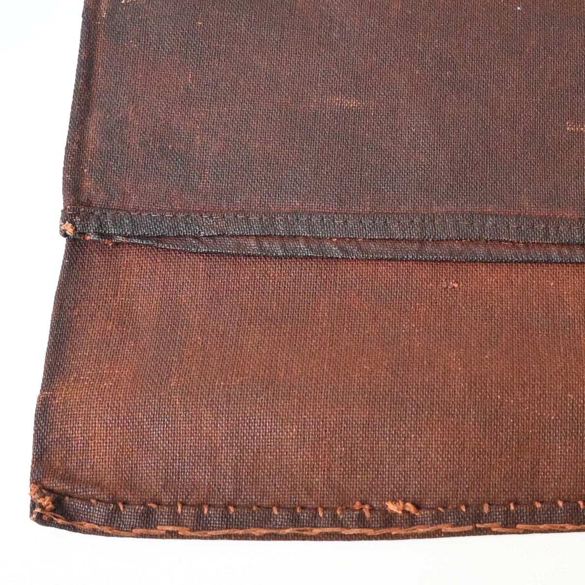 Detailed view of vintage kakishibu, fermented persimmon juice, dyed cotton sake bag sakabukuro.